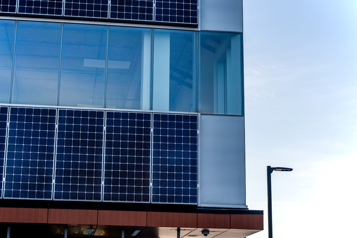 Government official discussing solar incentives with business owners